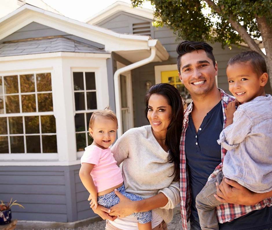 A family outside their home
